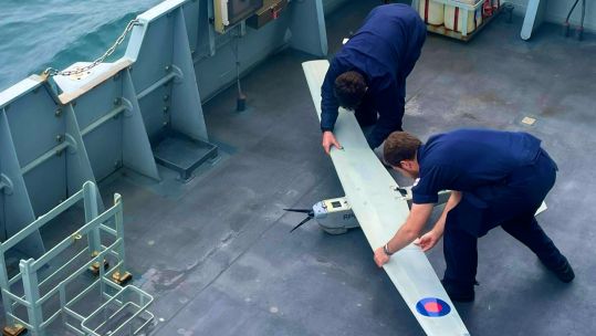 The crew of HMS Spey launching an uncrewed aircraft from the deck by hand (Picture: HMS Spey).
