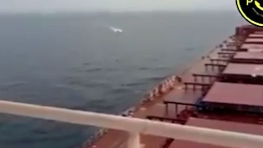 A Houthi terrorist attack in the Red Sea filmed by the crew of their latest target (Picture: MenchOsint)