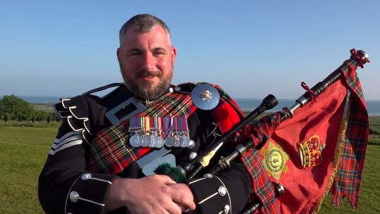 Lance Sergeant Dougie Warren has brought his grandfather's bagpipes back to Normandy, 80 years after they were brought to the beaches