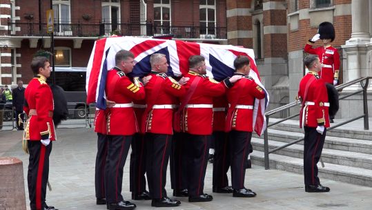 Field Marshal Lord Guthrie's coffin is carried into Westminster Cathedral