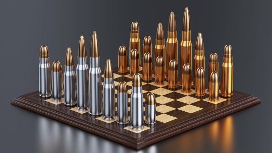 Image ID: E550J3 3d render of battle field with bullets on chess table on background with reflection. CREDIT: Denys Rudyi / Alamy Stock Photo