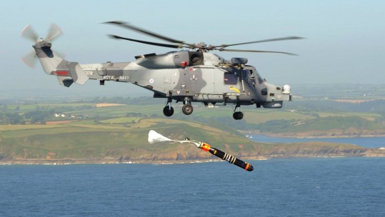 Fleet Air Arm Wildcat helicopter fires Sting Ray torpedo
