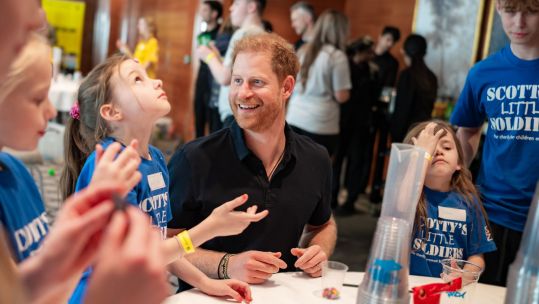 Prince Harry chats to members of Scotty's Little Soldiers (Picture: Scotty’s Little Soldiers)