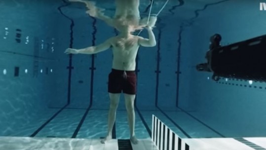 Scientist Experiments With Underwater Assault Rifle