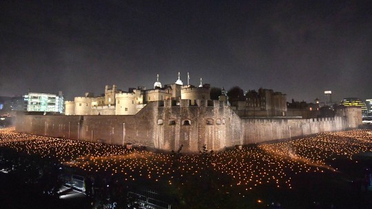 Thousands of flames have been lit around the Tower of London, to remember all those lost in the First World War, and in every conflict since (Picture: PA).
