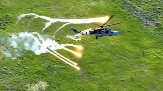 Ukrainian Hind helicopters deploying countermeasures and filling the sky with smoke during a battle against Russian ground targets (Picture: Ukraine MOD)