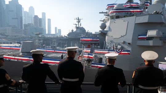 us marines observing the The new Arleigh Burke-class guided-missile destroyer USS John Basilone
