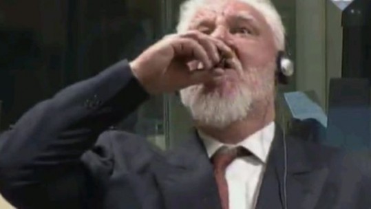 War Criminal Takes Poison