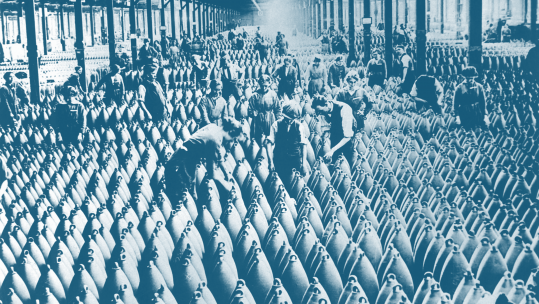 Munitionettes women interspersed amongst large artillery shells on a factory floor as duotone