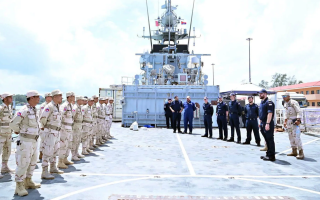Cambodian military personnel line up on HMS Tamar's flight deck (Picture: MOD)