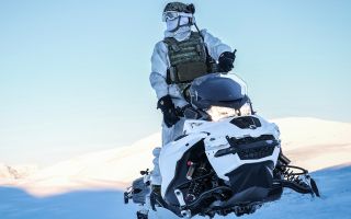 A member the Surveillance and Reconnaissance Squadron from 30 Commando operates an Oversnow Reconnaissance Vehicle in Norway
