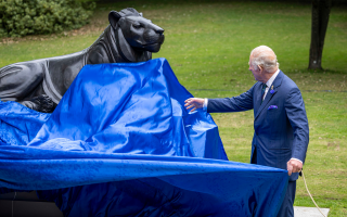 The King unveils the bronze lion statue marking 20 years of The Royal Regiment of Scotland in Princes Street Garden