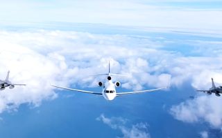 President Macron arrived at the base housing France's nuclear ballistic missile submarines, escorted by two Rafale fighter jets