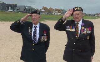 030626 D-day veterans Ken Hay and Henry Rice salute CREDIT BFBS
