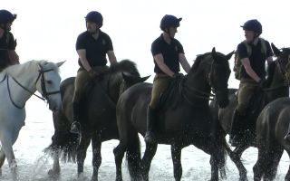 With their ceremonial duties over for the time being, it was time to soak up the sun and have a soak in the sea (Picture: BFBS)