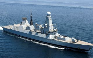 Despite arming up, defence officials have said HMS will not leave for Cyprus until next week
