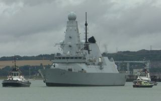Dodging squally showers, HMS Dauntless set sail from her home port of Portsmouth for a period of training (Picture: BFBS)