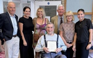 With Fred Bickham are Giles Ebbutt (right), Chair of the Yealm branch of the Royal British Legion in Devon, Tim Harbinson (left) and his family (Picture: Royal Navy)