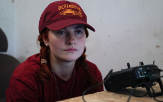 Mavka studies the screen of a UGV (unmanned ground vehicle) in a control centre not far from the frontline