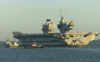  Hundreds of friends and family lined Portsmouth Harbour to wish HMS Queen Elizabeth goodbye (Picture: BFBS)