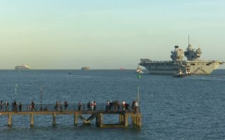 Hundreds of friends and family lined Portsmouth Harbour to wish HMS Queen Elizabeth goodbye (Picture: BFBS)