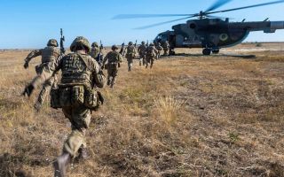 Troops from 16 Air Assault Brigade embark on a Ukrainian Mil Mi-8 assault helicopter