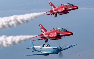 The Spitfire flew in formation with two Red Arrows Hawks as it made its way to Leuchars Station