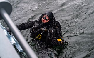 A Portuguese diver conducts underwater operations during exercise Freezing Winds