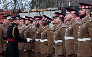 The Duke of Edinburgh presents Nato operational service medals to soldiers from 1st Battalion, The Scots Guards