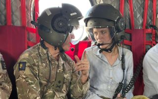 Minister for Veterans and People Louise Sandher-Jones with Commander British Forces Major General Tom Bewick in a Chinook in Cyprus