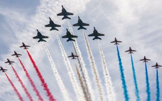 The Red Arrows perform a mixed formation flypast with their US Navy counterparts the Blue Angels in Maine as they continue their US tour marking 250 years since the declaration of independence