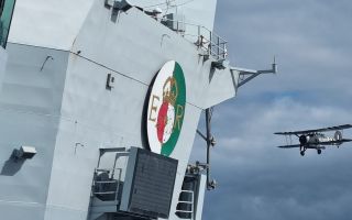 The 65,000-tonne aircraft carrier's crew caught a glimpse of the Stringbag from the flight deck (Picture: HMS Queen Elizabeth X)