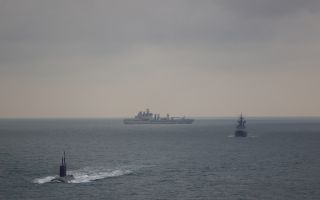 A Merlin helicopter from 814 Naval Air Squadron and RFA tanker Tidesurge followed the Russian submarine Krasnodar