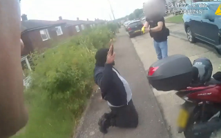 Screenshot of police cam footage of the moment Anthony Esan was arrested outside his home 