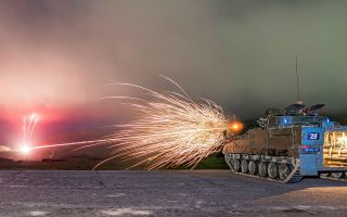A Warrior IFV opens fire with its 7.62mm chain gun during a gunnery course to qualify personnel as Armoured Cavalry Troop Leaders or Warrior Platoon Commanders