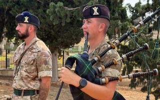 A bugler and piper played The Last Post, Reveille and a Scottish lament as the battalion remembered the fallen (Picture: BFBS)