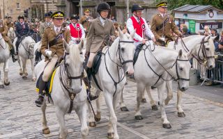 Princess Anne rides alongside Scots DG soldiers and the Lord Provost at Edinburgh Riding of the Marches