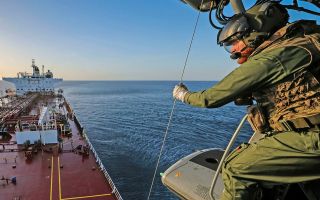 The Merlin carried officers from the National Crime Agency and extra items of kit on board the Cameroon-registered tanker (Picture: MOD)