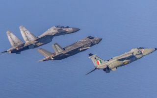 At the end of mock hostilities, a British F-35B is flanked by an Su-30MKI and a Jaguar