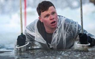 Personnel conduct ice-breaking drills at the end of the Cold Weather Aviation Operator Course during Operation Clockwork in Bardufoss