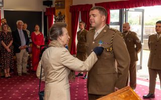 The Princess Royal, who acts as Colonel-in-Chief for the Royal Logistic Corps, pins the medal on Capt Livingstone (Picture: MOD)