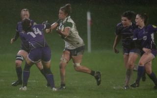 Ellie Brightwell pushing through rain and tackles for Navy women rugby Credit Windandsurf Images.jpg