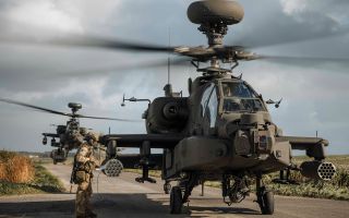Army Air Corps AH-64E Apaches show off their versatility as they operate from a narrow track, with a support vehicle coming up from behind (Picture: MOD)