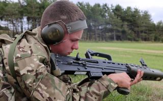 A cadet carries out his Normal Safety Precautions drills on his L98A2 Cadet GP rifle, looking inside to check the chamber, the body of the rifle and the face of the bolt are clear (Picture: BFBS)