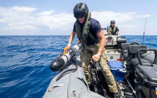 Sailors from X-Ray Squadron retrieve Remus, an autonomous underwater vehicle that scans the water for sea mines