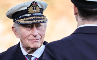 His Majesty the King inspects the ranks in the Royal Guard at Britannia Royal Naval College Dartmouth