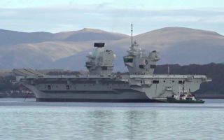 HMS Queen Elizabeth is currently in the Forth where she is believed to be waiting for the right tide before continuing her journey