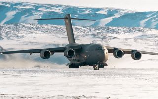 The C-17 landed on a semi-prepared runway of gravel and compacted snow after staging through Pituffik Space Base in Greenland