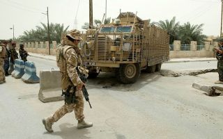 A Mastiff armoured vehicle on patrol in Basra manouevres around roadworks in the southern Iraqi capital CREDIT MOD