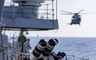 HMSRCMD with Wildcat helo and USS Higgins in Taiwan Strait